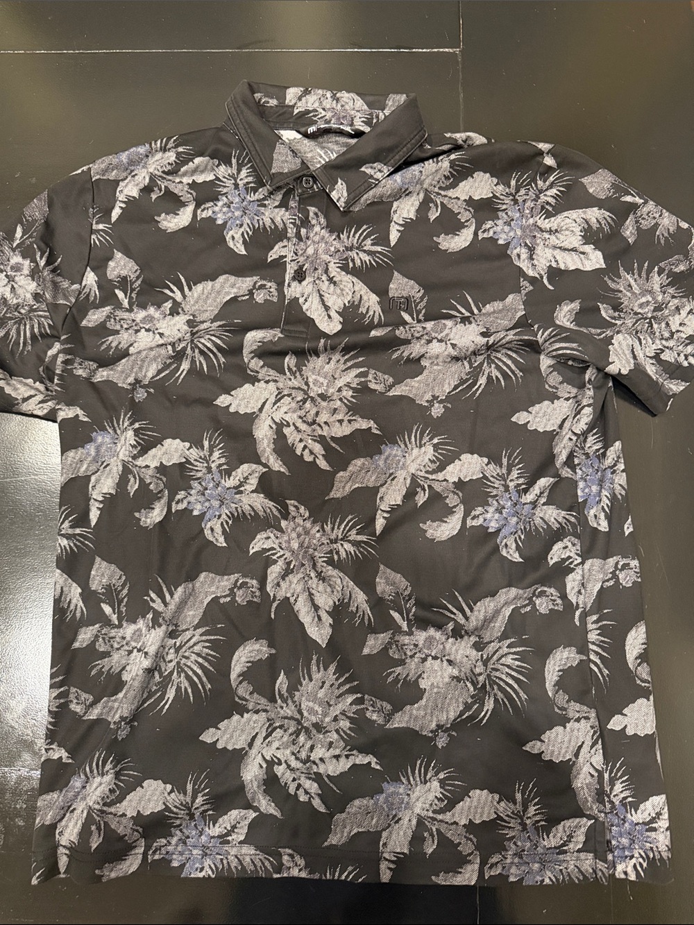 Travis Mathew Black Polo with Gray and Blue Tropical Print